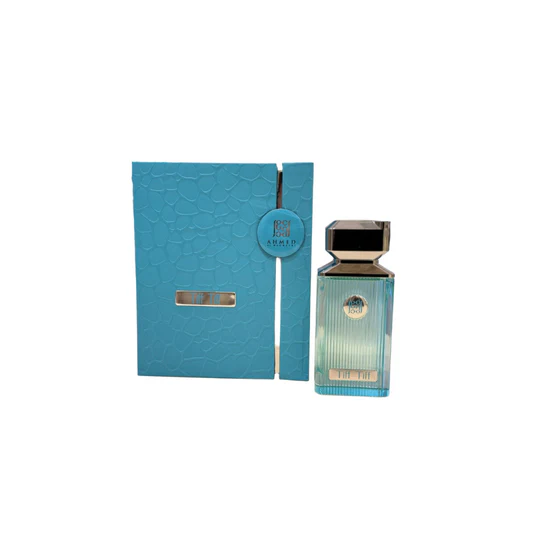 Luxury Arabian perfume bottle with metallic cap and matching textured blue box
